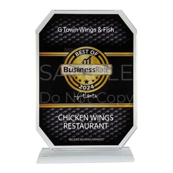 A black and gold award plaque for G Town Wings & Fish, "Best Chicken Wings Restaurant 2024".