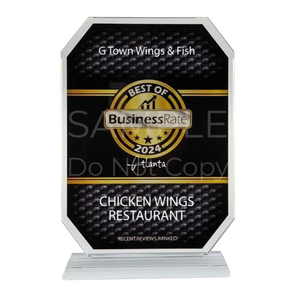 A black and gold award plaque for G Town Wings & Fish, "Best Chicken Wings Restaurant 2024".